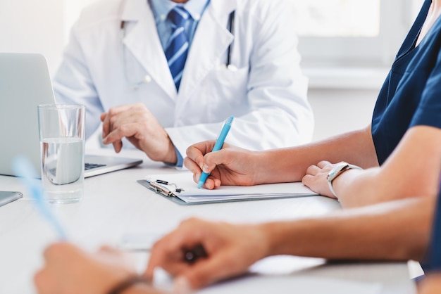 Cropped image of medical professional meeting in hospital office