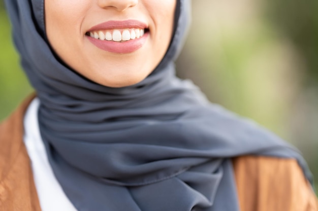 Cropped image of the smile of a muslim woman