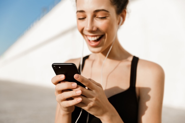 Cropped image of smiling young sportswoman