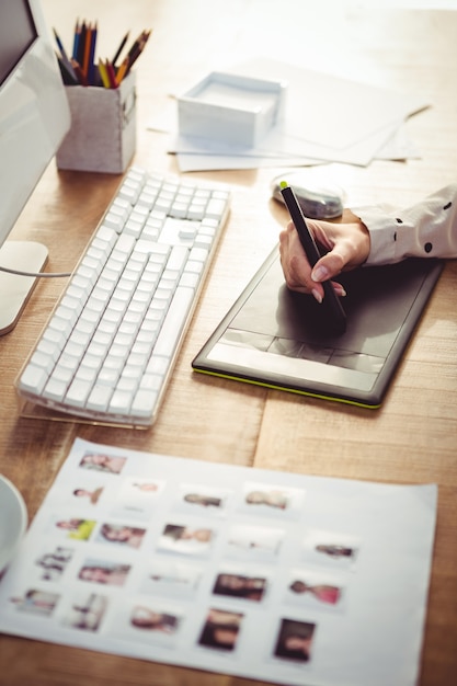 Cropped image of woman using graphics tablet 