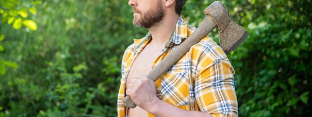 Cropped photo of rancher with axe rancher with axe rancher with axe wearing checkered shirt