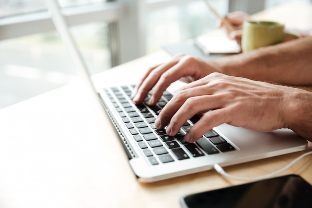 Cropped photo of young man in office coworking