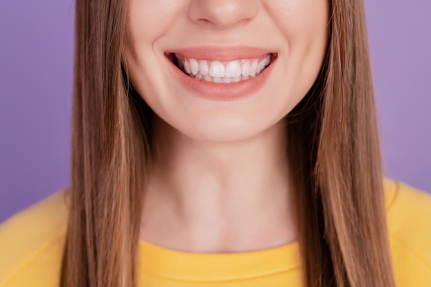 Cropped portrait of healthy lady toothy shiny smiling demonstrate healthy gums on violet background