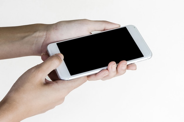 Cropped shot view of Asian woman's hands holding smart phone