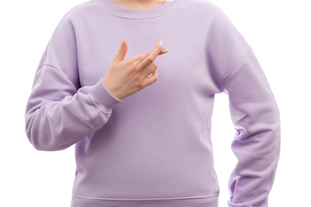 Cropped shot of a woman in a sweatshirt is holding fingers crossed for good luck hoping for miracle