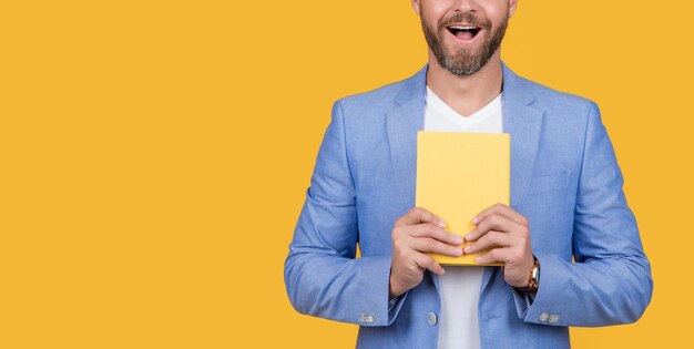 Cropped studio shot of guy holding agenda photo of guy hold agenda guy with agenda