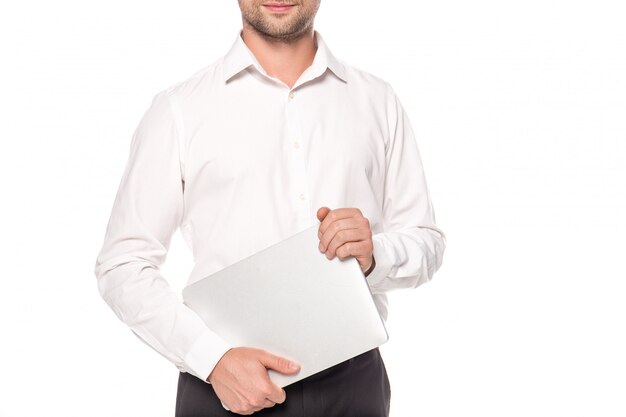 cropped view of businessman holding laptop isolated on white