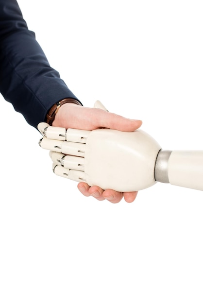 Cropped view of businessman shaking hands with robotic arm isolated on white