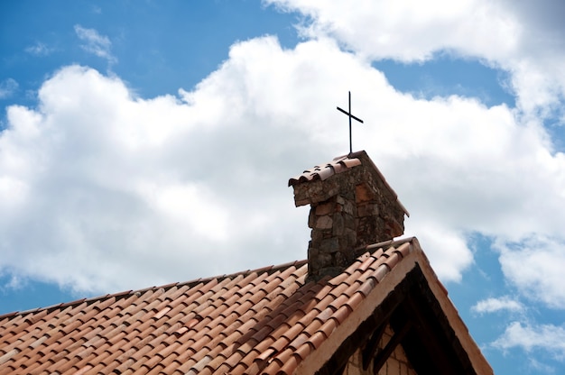 Cross on the roof of a church in the village of Altos de Chavon.