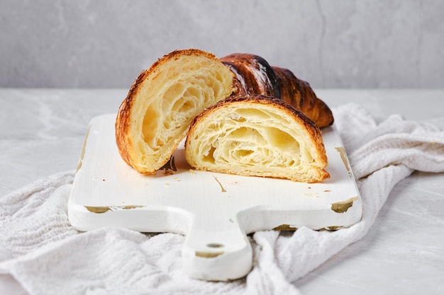 Cross section of classic croissant on marble background