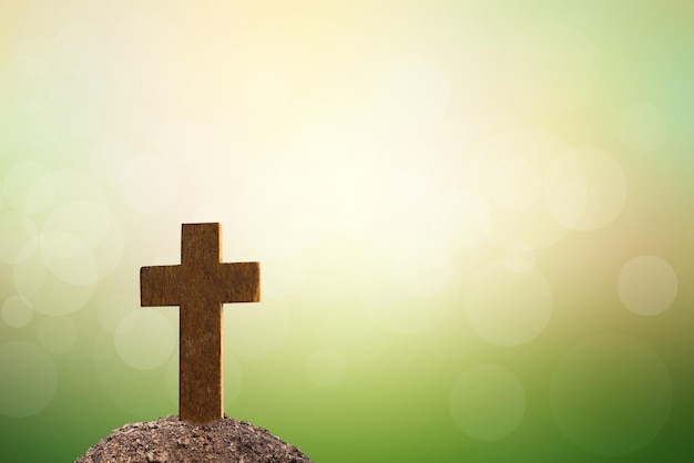 Cross on tomb nature blur background