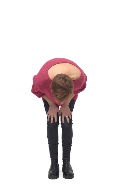 Crouched woman looking at the ground searching on white background