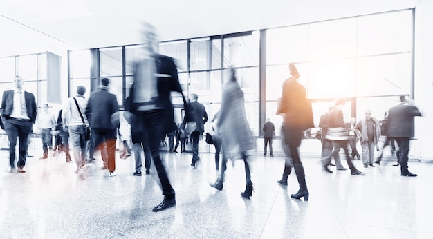 Crowd of blurred business people rushing in a trade show hall