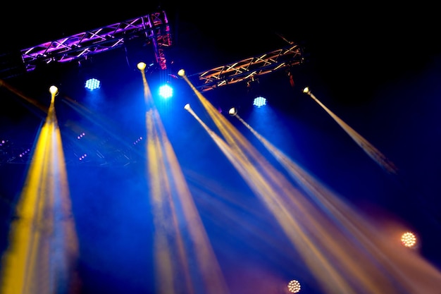 Crowd at concert Cheering crowd in bright colorful stage lights