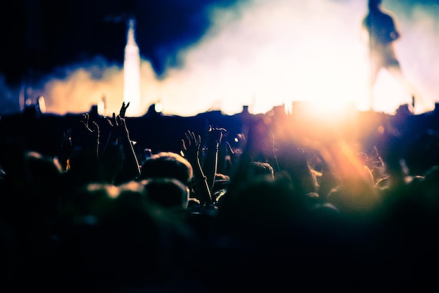 Photo crowd partying stage lights live concert summer music festival