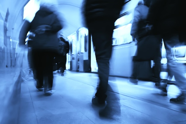 crowd of people metro in motion blurred, abstract background urban traffic people