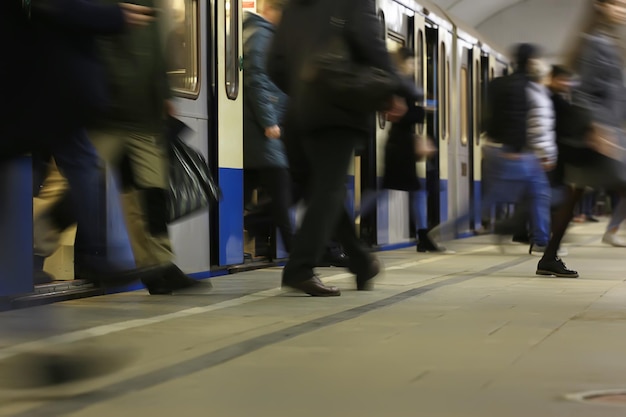 crowd of people metro in motion blurred, abstract background urban traffic people