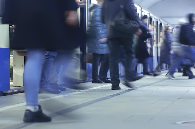 crowd of people metro in motion blurred, abstract background urban traffic people