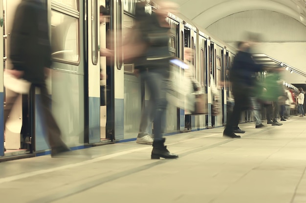 crowd of people metro in motion blurred, abstract background urban traffic people