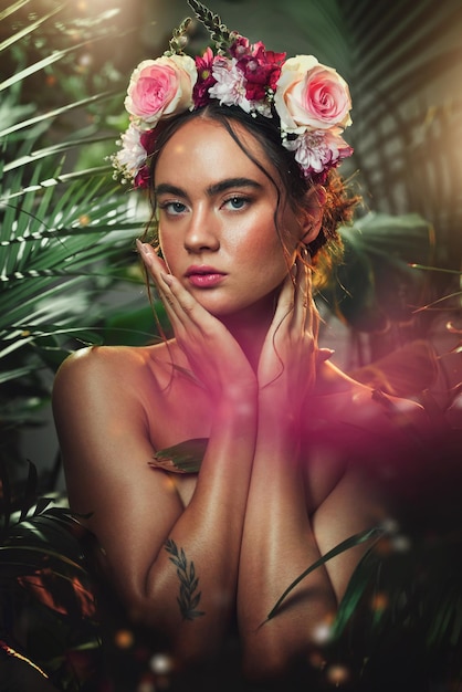 Crown flower and portrait of woman in studio for skincare beauty and product from nature wellness and makeup Jungle rose and face of girl model with leaf plant and creative forest aesthetic