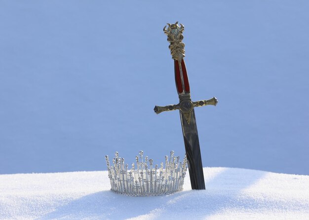 crown and sword in the snow