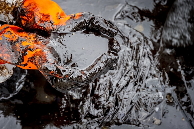 Crude oil along the beach of Ao Phrao after a nearby oil spill in Gulf of Thailand.