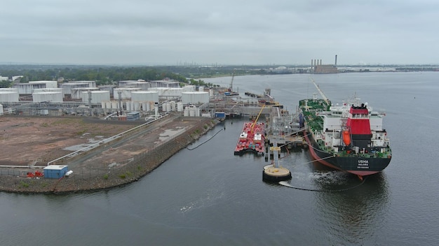 Crude oil tanker is uploading in the port terminal