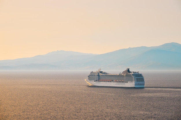 Cruise ship in aegean sea on sunset