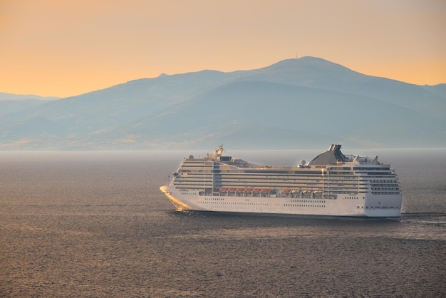 Cruise ship in Aegean sea on sunset