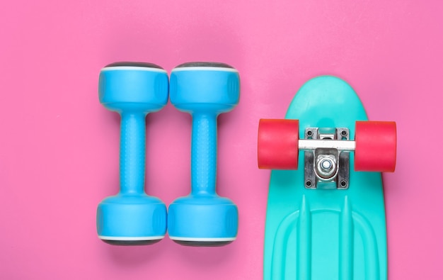 Cruiser board and dumbbell. Top view