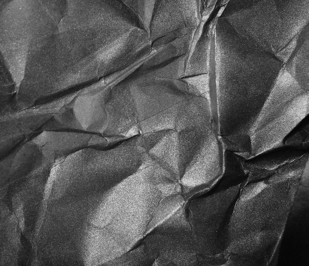 Crumpled black paper background