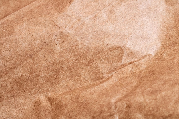 Crumpled brown paper close up abstract background