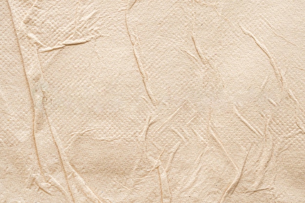 Crumpled brown recycle tissue paper texture abstract background