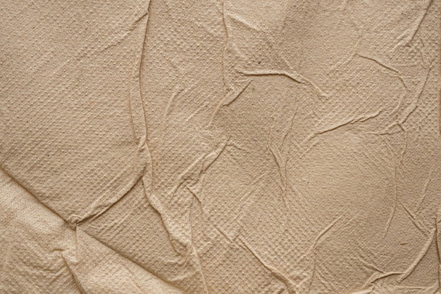 Crumpled brown recycle tissue paper texture abstract background