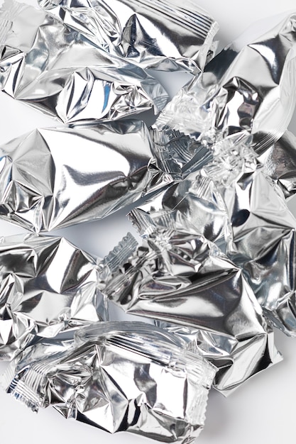 Crumpled foil trash on white background