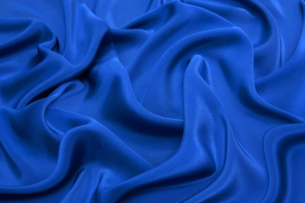 Crumpled knitted dark blue fabric.