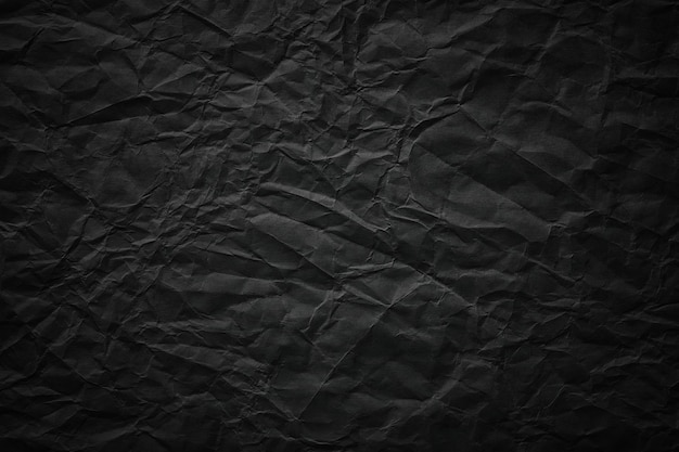 crumpled paper texture black cardboard sheet gloomy background