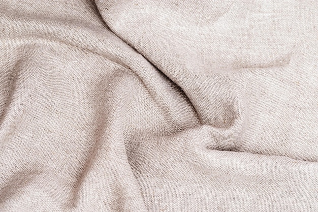 Crumpled sackcloth backgrounfd Natural cloth texture close up of coarse fabric for backdrop Creases on fabric