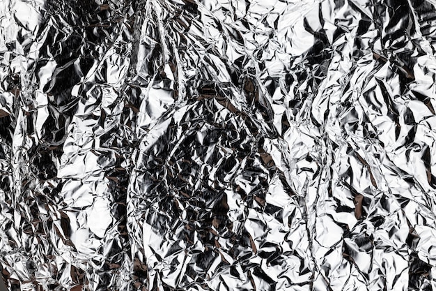 Crumpled silver foil sheettexture of shiny crumpled piece foil