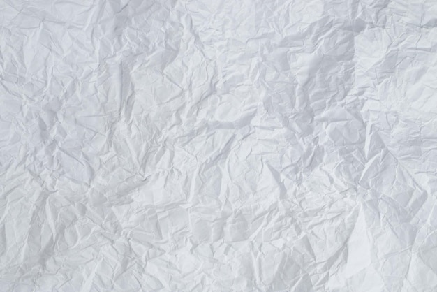 Crumpled white paper background. Top view. Copy space.