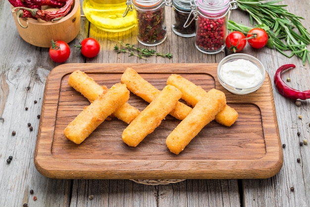 Crunchy Breaded mozzarella cheese sticks with mustard sauce. Beautiful stylish menu.