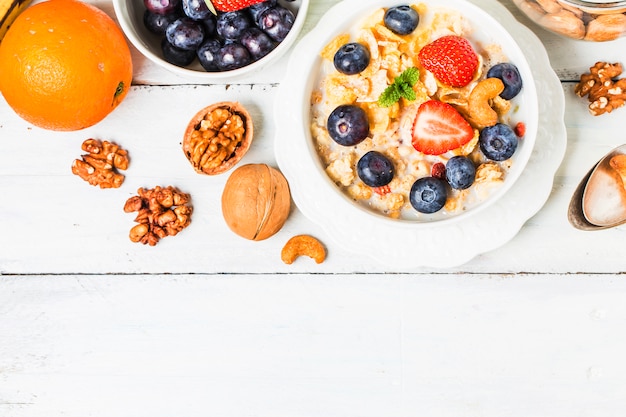 crunchy flakes with blueberries and various yogurts for healthy breakfast