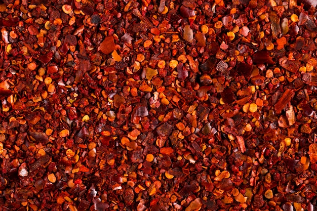 Crushed dried chili pepper red , close-up macro. , copyspace.