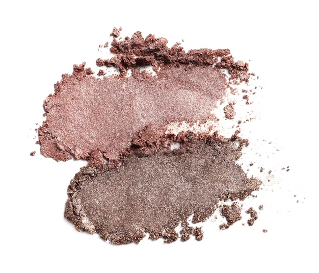 Crushed eye shadows on white background top view Professional makeup product