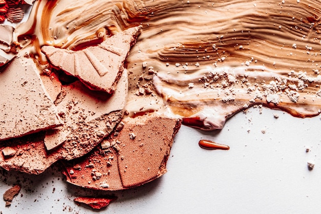 Crushed makeup products beauty and cosmetics styled concept