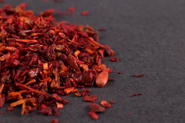 Crushed paprika close-up, macro, on the table. copyspace.