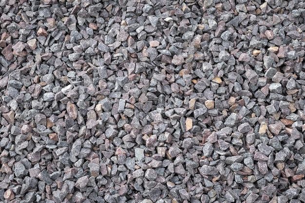 Crushed rock close up Stone road building material gravel texture background