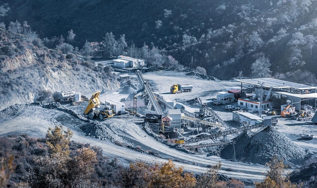 Crushing and screening plant in stone quarry at work aerial view