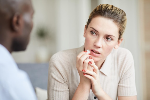 Crying girl listening to psychologists advice