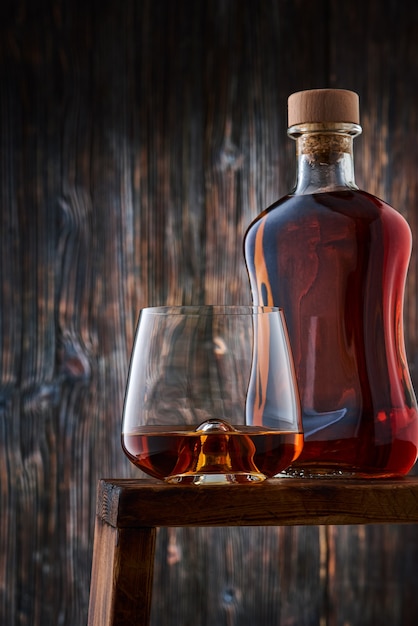 Crystal glass and bottle with whiskey